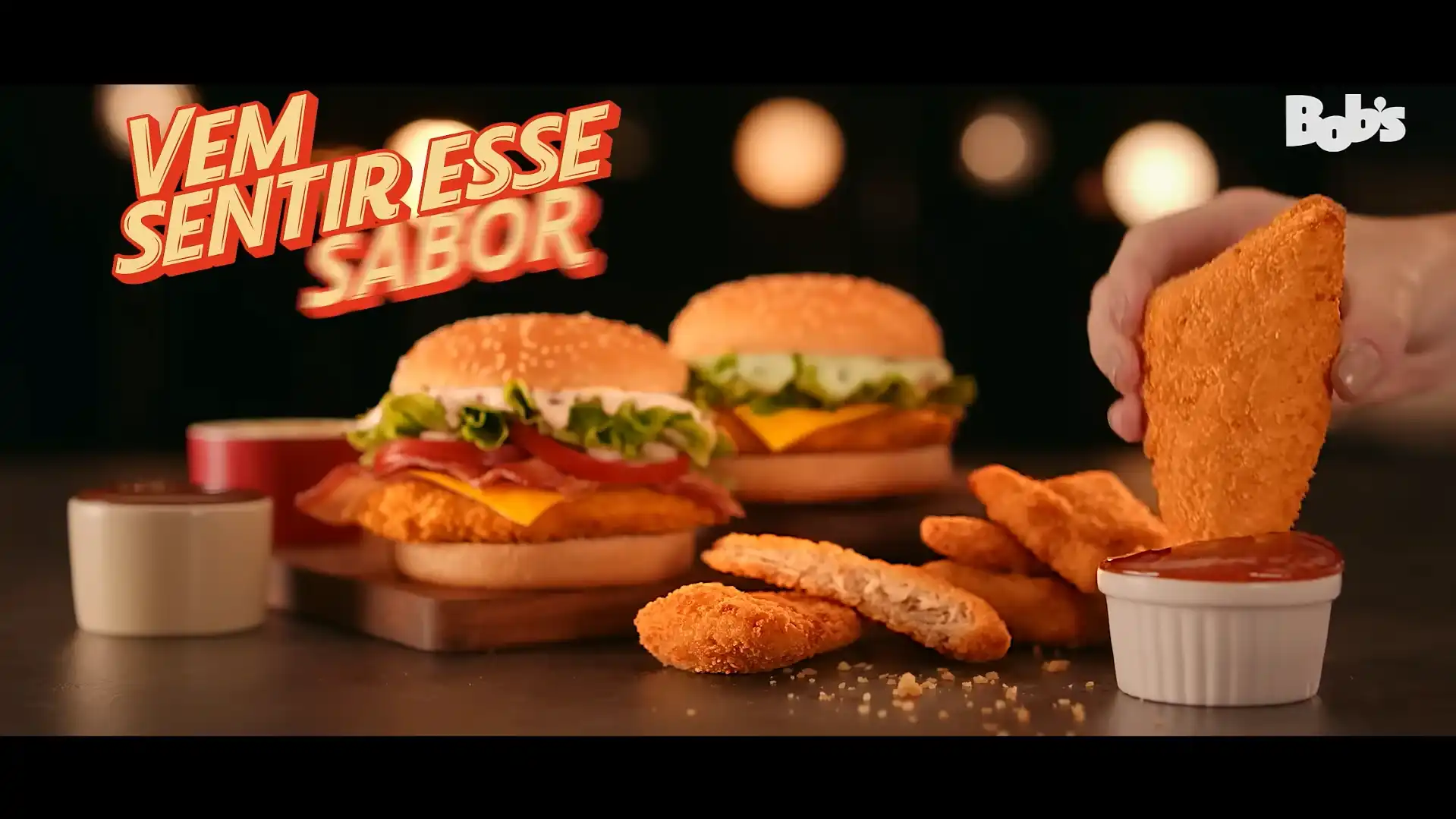 Propaganda do Bob's com hambúrgueres e frango empanado.