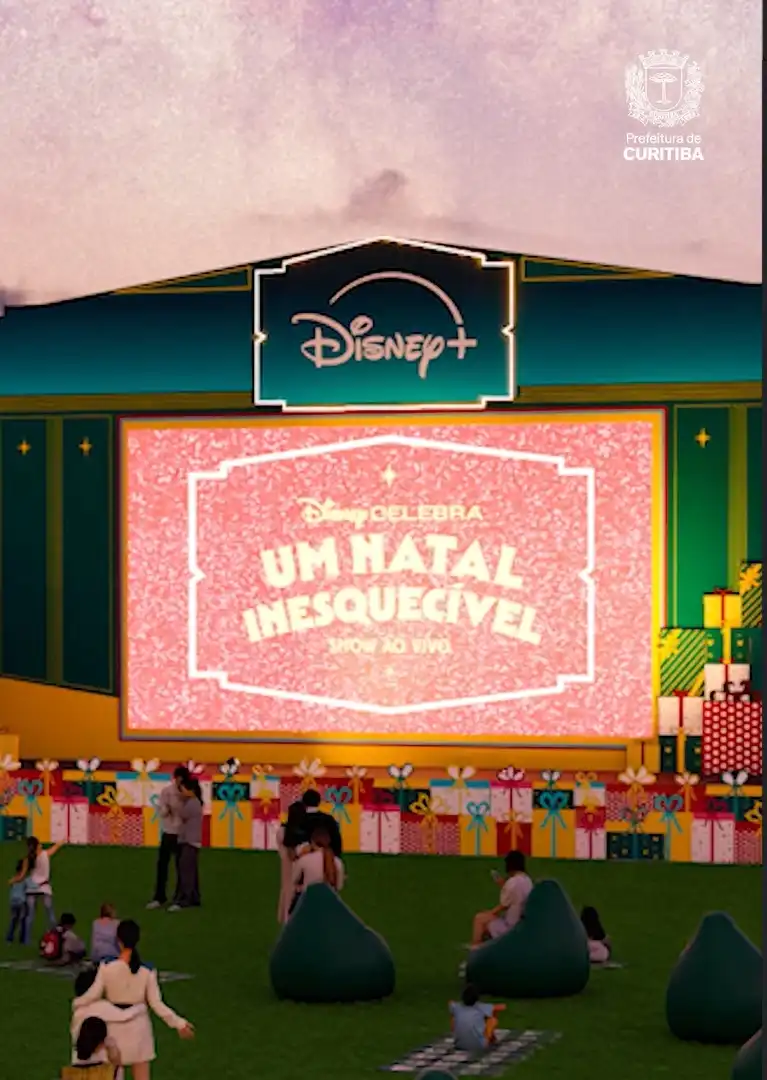 Famílias assistem a um show de Natal da Disney ao ar livre.
