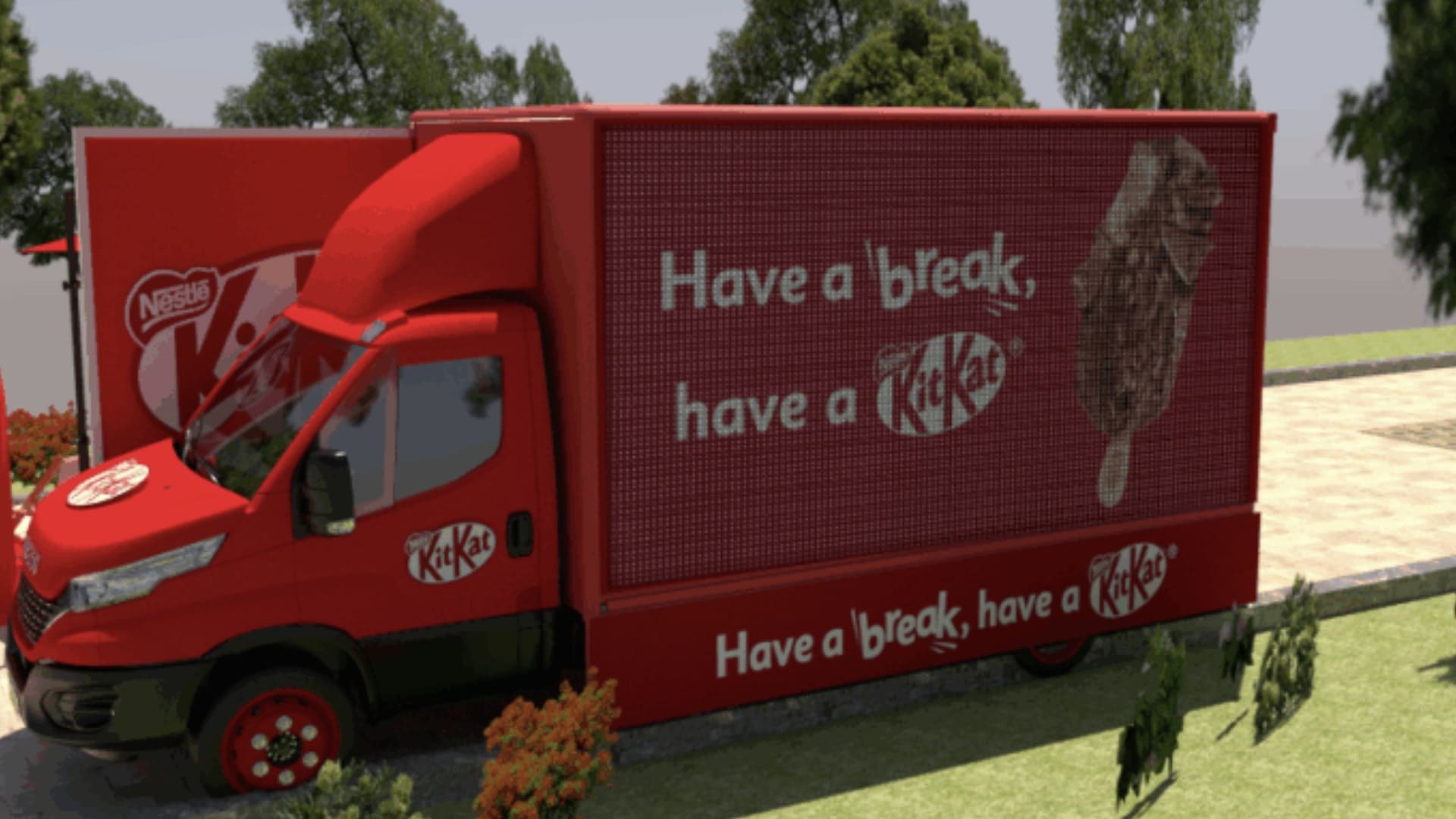 Caminhão de ativação da KitKat vermelho com painel lateral mostrando a frase "Have a break, have a KitKat" e imagem de um sorvete.